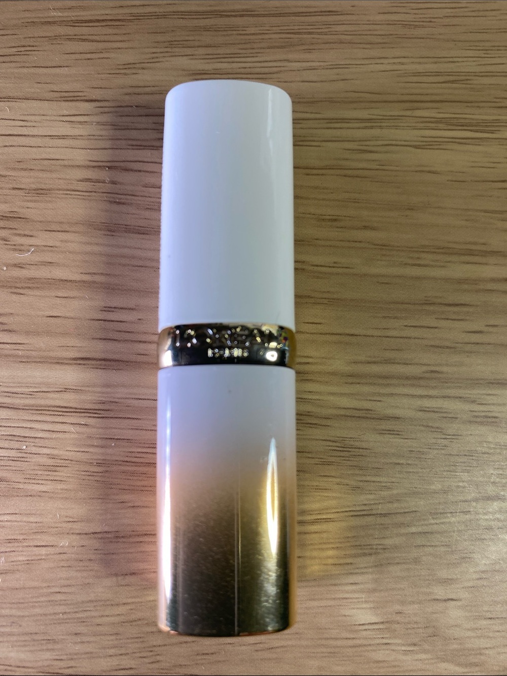 L'Oreal Gold Lipstick Tube with Vibrant Fuchsia Label 206